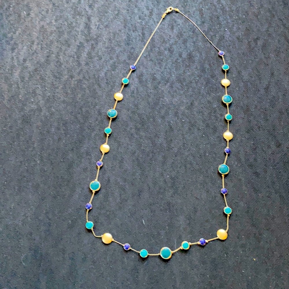 Beautiful gold long hanging necklace with blues and turquoise’s